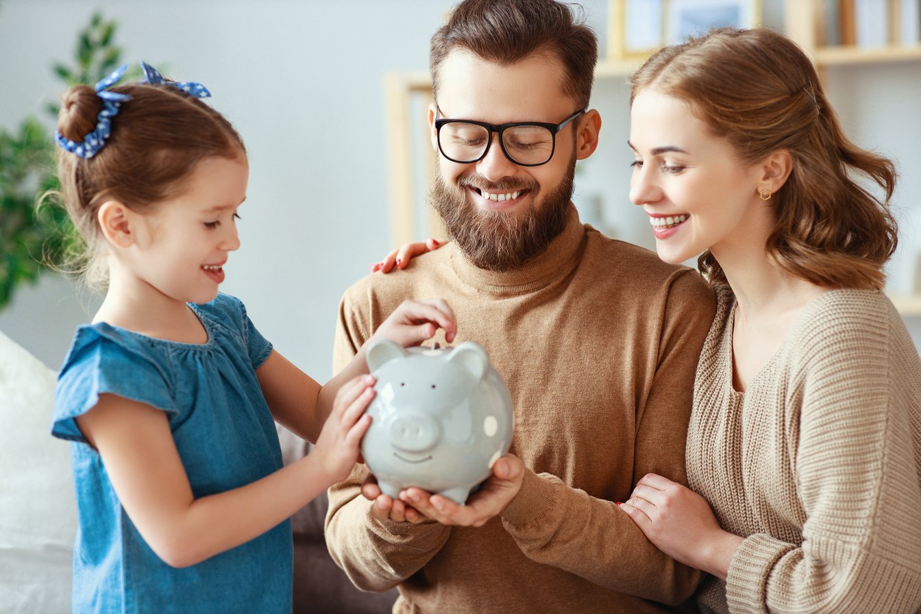 family savings, budget planning, children's pocket money. family with piggy Bank